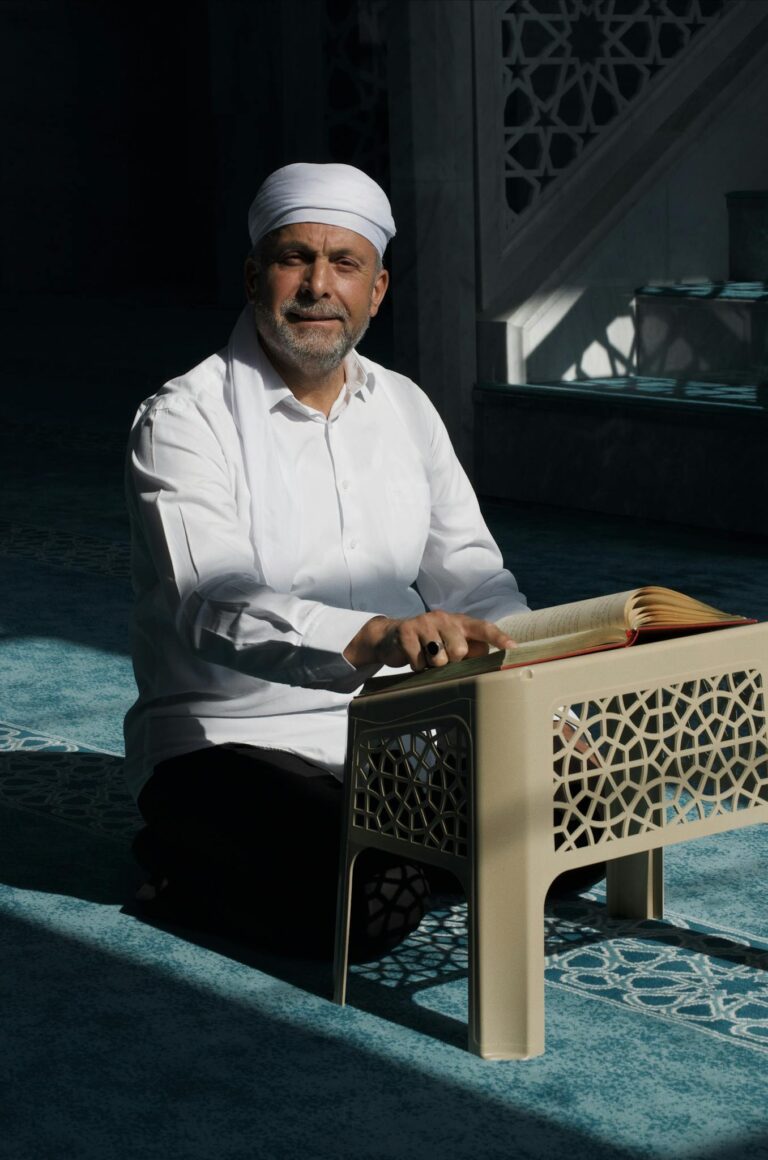 Middle-Eastern Man Reading Holy Book in Mosque